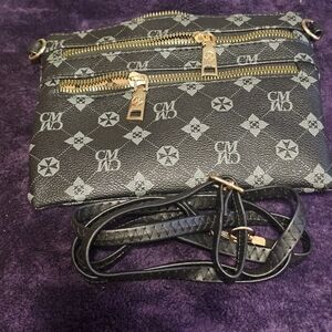 Black Crossbody Bag with Gold Zippers With Two Front Zipper Packets.